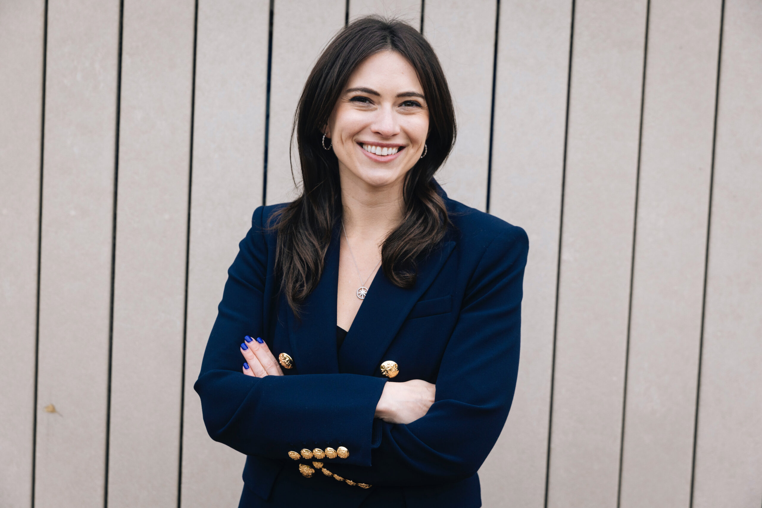 Rep. Margaret Croke in blue blazer smiling